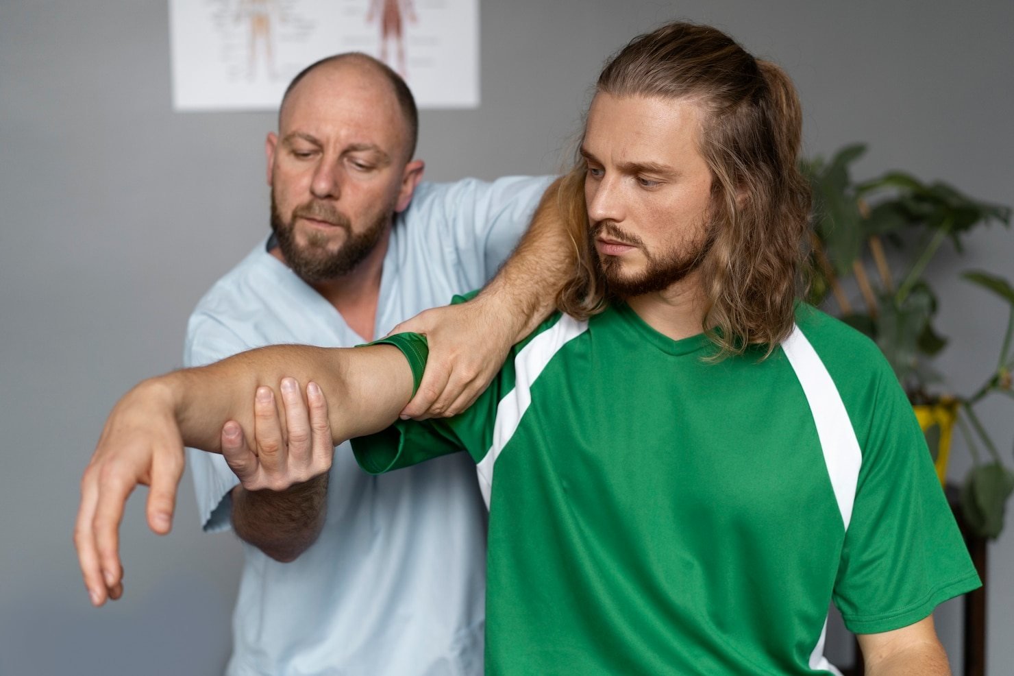 A practitioner assessing a patient’s shoulder range of movement